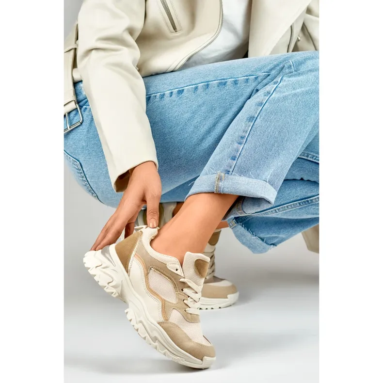 Women's beige sneakers on a white sole