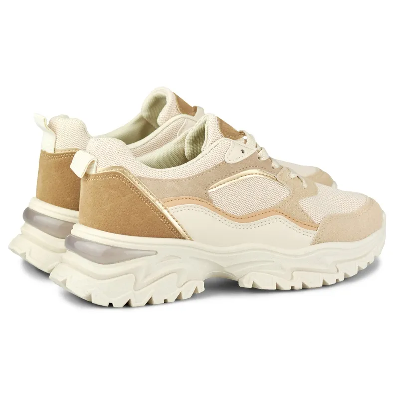 Women's beige sneakers on a white sole